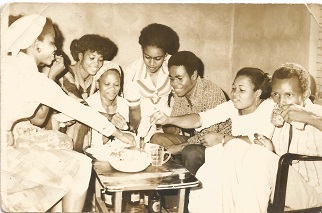 Rose on igba nkwu day sharing a meal with her friends